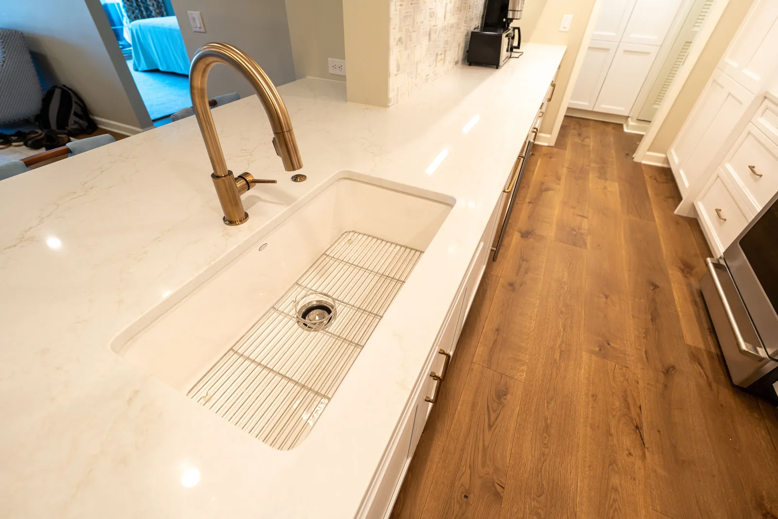 A stainless steel kitchen sink with a chrome drain strainer