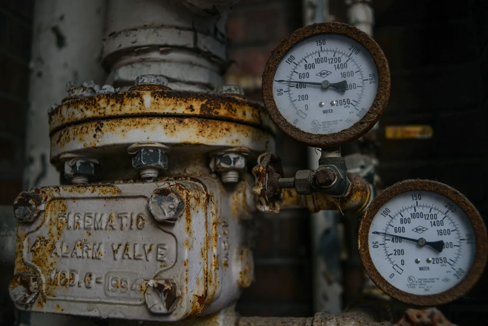 An aged pressure valve fitted with dial gauges